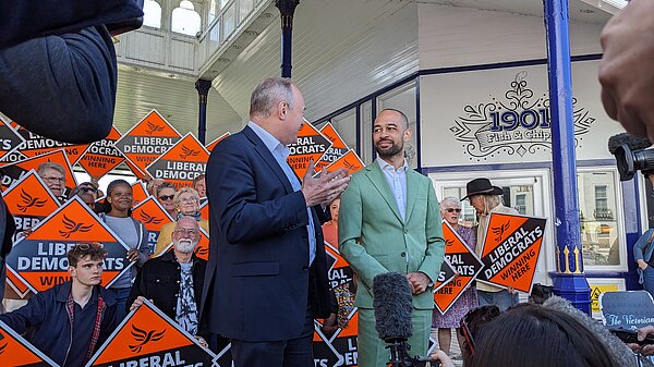 Josh and Ed Davey with the media